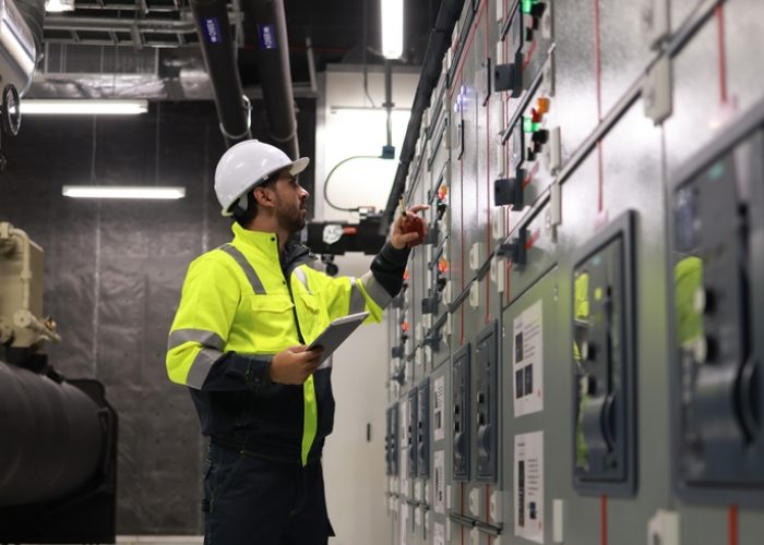 Engineers,Working,In,The,Main,Control,Room,Of,A,State-of-the-art Engineers,Working,In,The,Main,Control,Room,Of,A,State-of-the-art